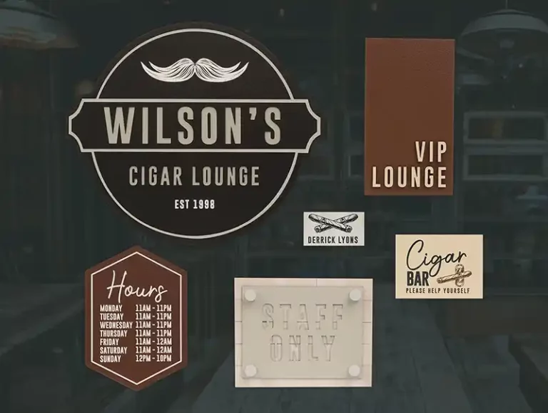 Image montrant la signalétique du Wilsons Cigar Lounge, fondé en 1998. Les caractéristiques comprennent un salon VIP, un bar à cigares en libre-service et un espace réservé au personnel. Horaires douverture : du lundi au mardi de 11 h à 23 h, du mercredi au vendredi de 11 h à minuit, le samedi de 11 h à 1 h, le dimanche de 12 h à 23 h.