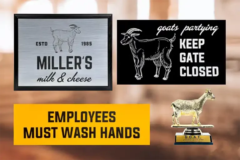 Trois panneaux et un trophée. En haut à gauche : « Millers milk & cheese » avec une chèvre, fondée en 1985. En haut à droite : « Goats partying, keep gate closed » avec un dessin de chèvre. En bas : « Employees must wash hands ». Trophée avec une chèvre étiquetée « G.O.A.T.